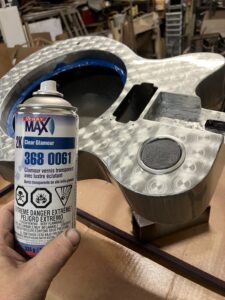 Resonator guitar process. Clear coat