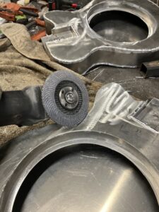 Resonator guitar body process. More grinding of the edge