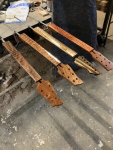 Resonator guitar neck process. Clear coating.