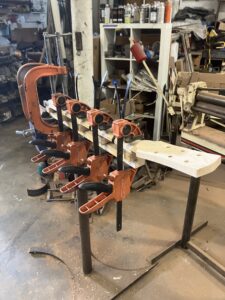 Guitar neck process. Gluing on fingerboard