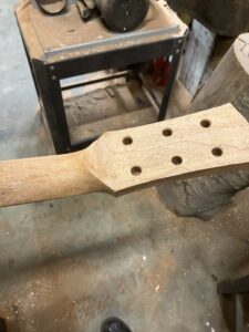 Guitar neck process. Finishing the headstock