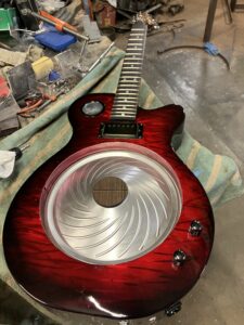 Resonator guitar in process. Installing cone